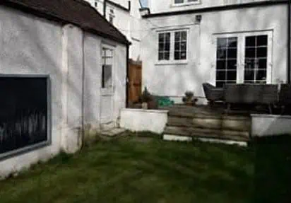 Garden with steps and seating area Before image